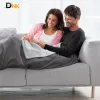 Ảnh Cặp Đôi Sử Dụng Chăn Sưởi Medisana Hb675, Mang Lại Sự Ấm Áp Và Gắn Kết Trong Gia Đình. Cặp Đôi Sử Dụng Chăn Sưởi Medisana Hb675 Trên Sofa